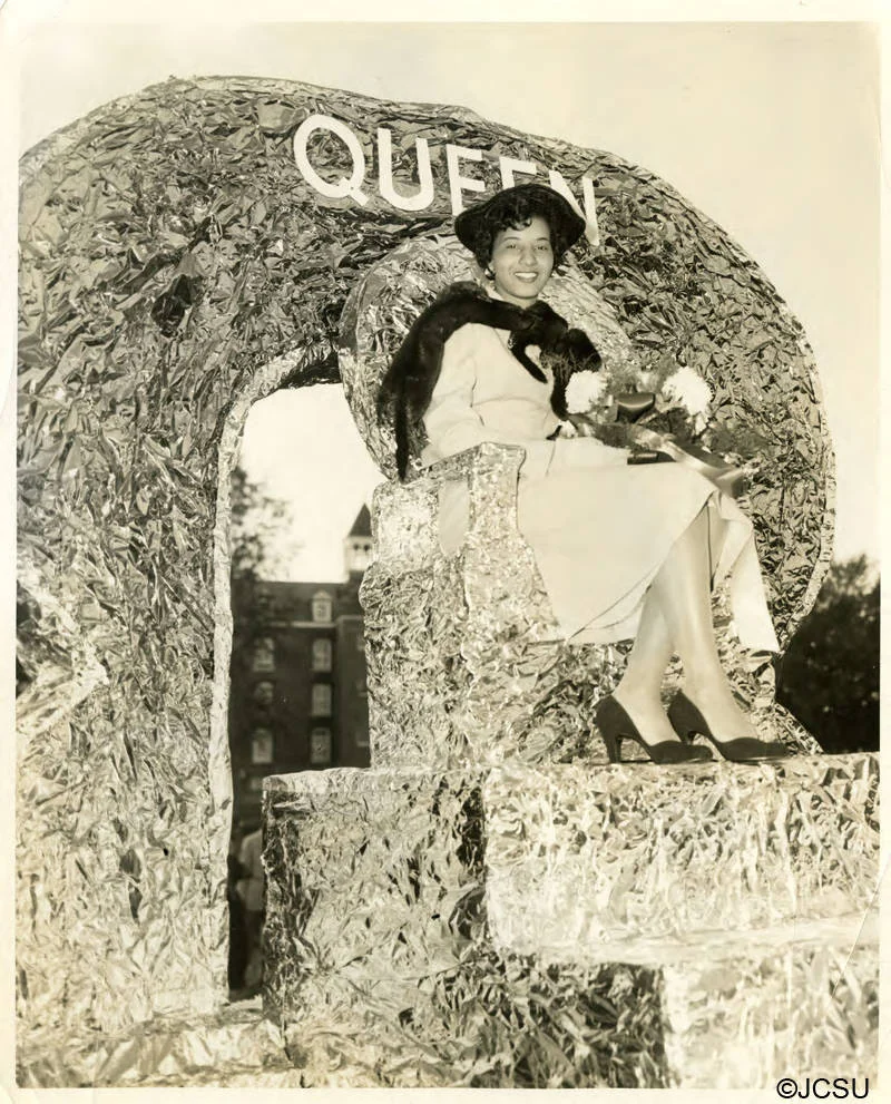 Homecoming parade float carrying Queen Cynthia Morrow