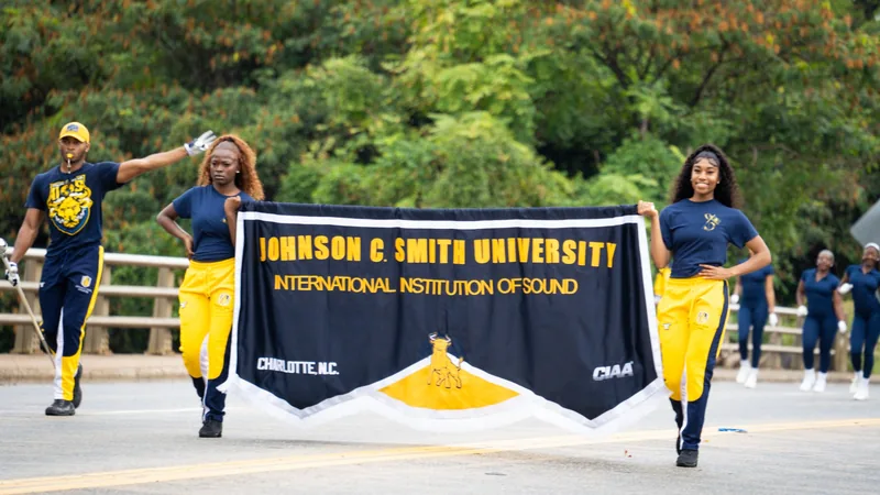 The Johnson C. Smith University banner leads the parade