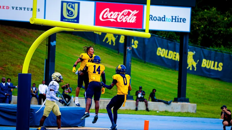 Golden Bulls in the end zone at Irwin Belk Complex