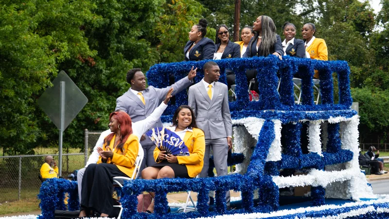A float rolls the Homecoming parade route